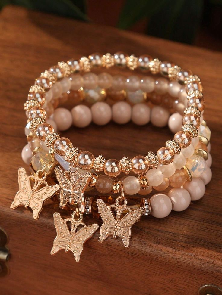 Cream and gold beaded stretch bracelet set with butterfly charms