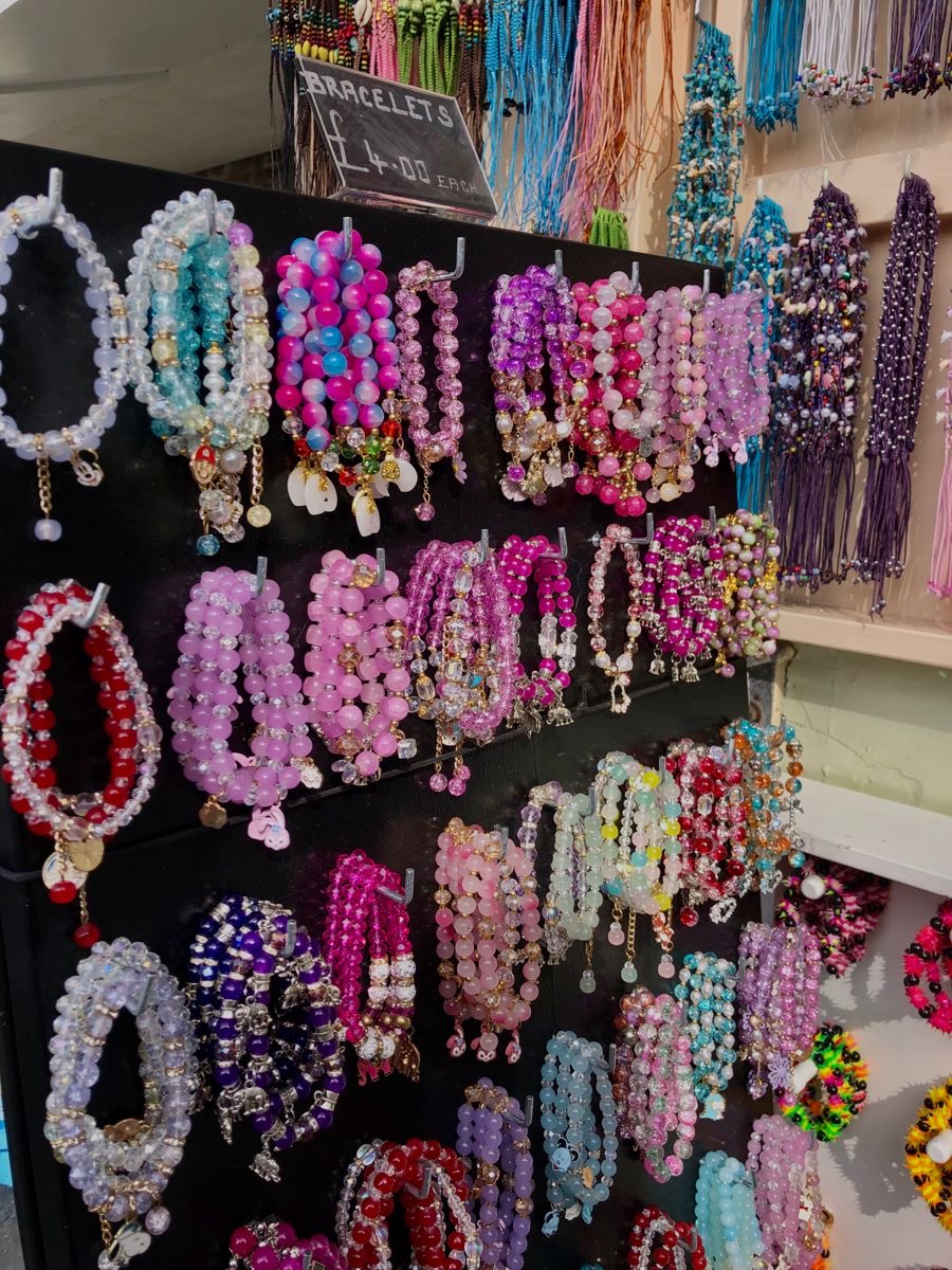 Market wall of handmade beaded bracelets in every colour